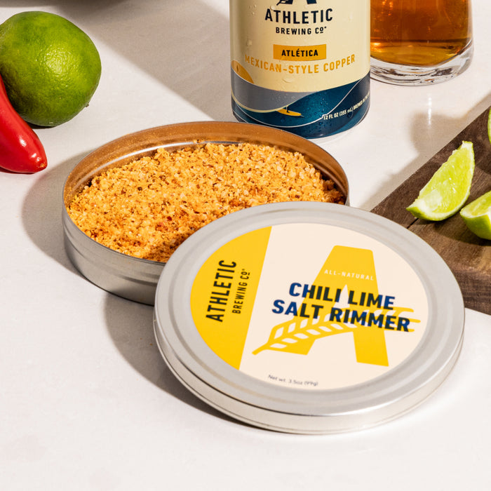 an open can of lime and salt rimmer on a kitchen counter with beer
