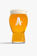 Craft master glass with beer showing the Athletic brewing logo