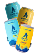 Athletic Brewing Co. products including cans, and two dog toys  on a white background