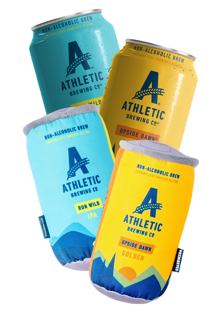 Athletic Brewing Co. products including cans, and two dog toys  on a white background