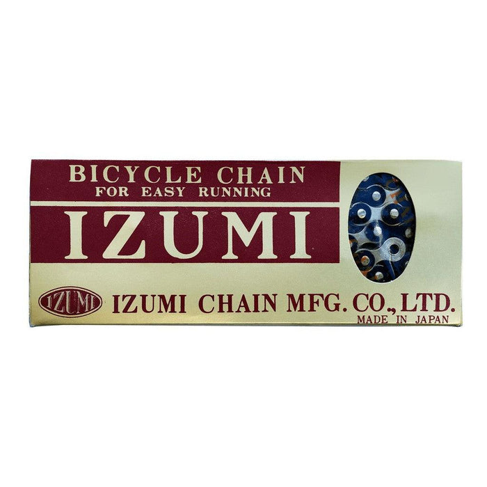 Izumi 1/2 x 1/8 Inch Chain packaging with a partial view of the chain inside; text indicates it is made in Japan by Izumi Chain MFG. Co., Ltd., renowned for producing high-quality track and durable BMX chains.