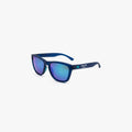 Navy blue sunglasses with mirrored blue-purple lenses and matte blue frames. The side arm features Knockaround and Athletic Brewing Co. branding in teal and white. The sunglasses are shown against a light gray background.