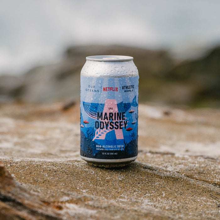 can of Marine Odyssey on beach