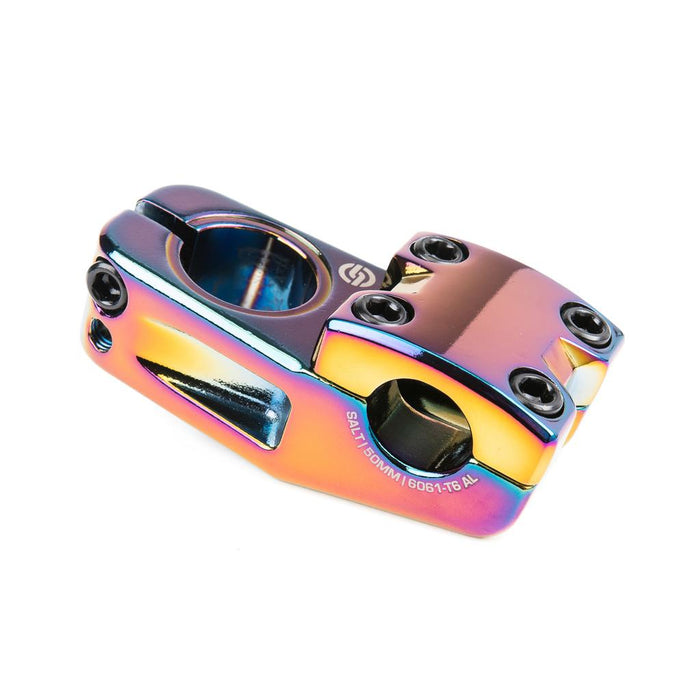 The Salt Am V2 Top Load Stem (22.2mm Clamp) is a vibrant, iridescent stem crafted from durable 6061-T6 aluminum alloy, featuring four bolt holes, smooth angular edges, and robust shark tooth clamping for superior grip and stability.