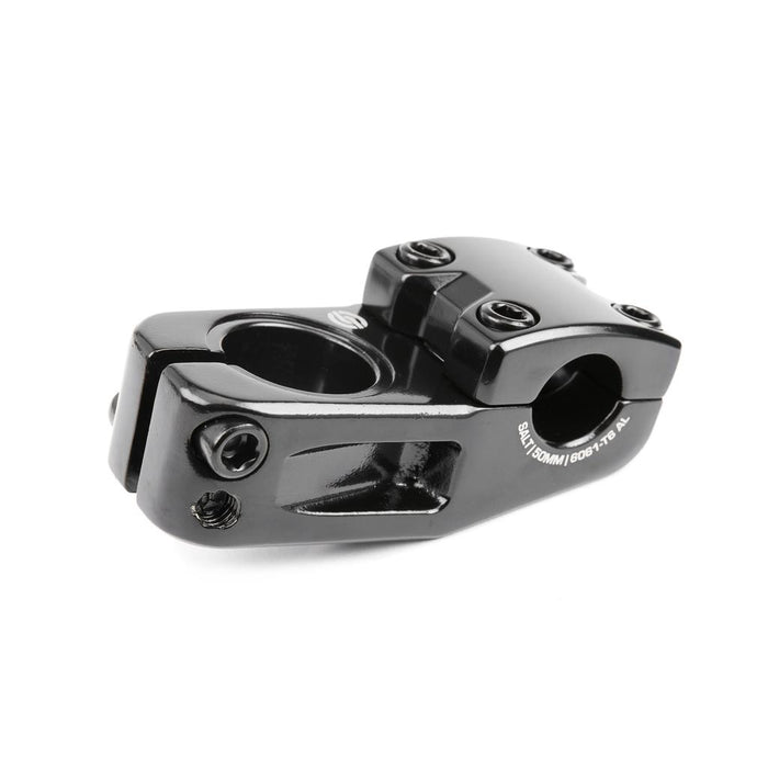 Introducing the Salt Am V2 Top Load Stem (22.2mm Clamp): a black stem precision-crafted from 6061 T6 alloy, featuring a four-bolt faceplate and side clamp design. This top load stem uses shark tooth clamping for a secure grip, making it ideal for attaching handlebars to the steerer tube.