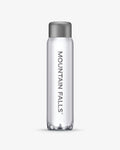 A 500ml clear sparkling mineral water bottle with the brand name 'Mountain Falls' printed on it.