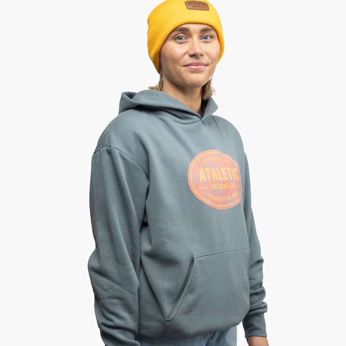 woman wearing Athletic Brewing StampHoodie