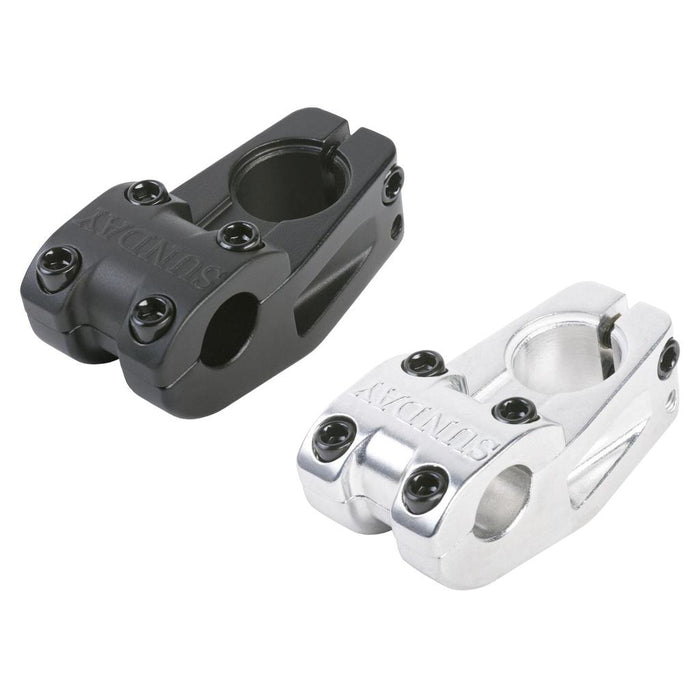 A pair of Sunday Freeze T/L Stems (22.2mm clamp) are displayed side by side on a white background, one in black and the other in silver. Each stem features visible bolts and “SUNDAY” engraved on top, showcasing the timeless design of these BMX top-load stems from Sunday Bikes.