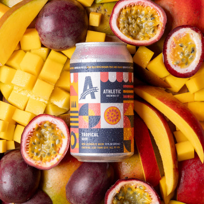a can of tropical sour on top of mango and passionfruit