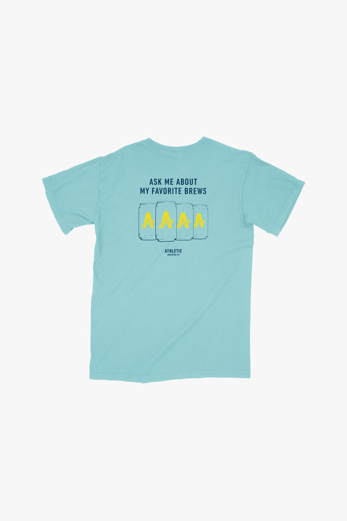 A blue ambassador athletic brewing co t-shirt with cans printed on the back