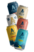 Assorted cans of Athletic Brewing Co. non-alcoholic beer on a white background