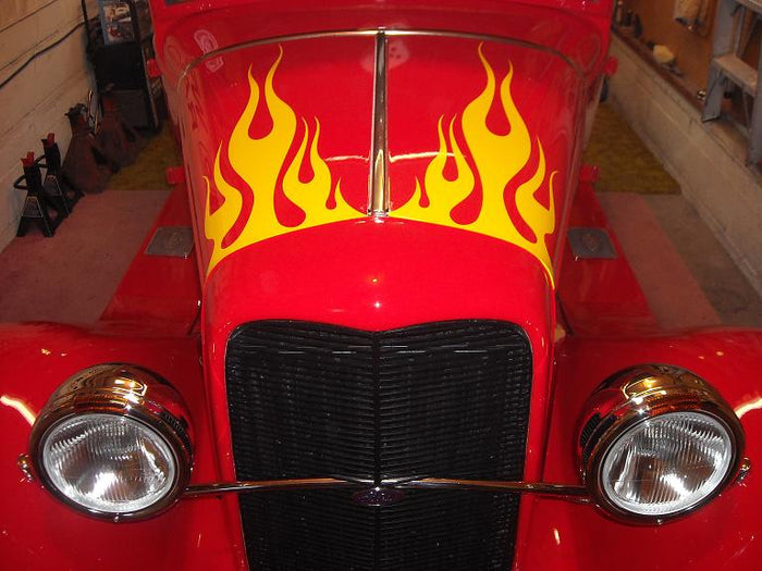 a red car with flames painted on it